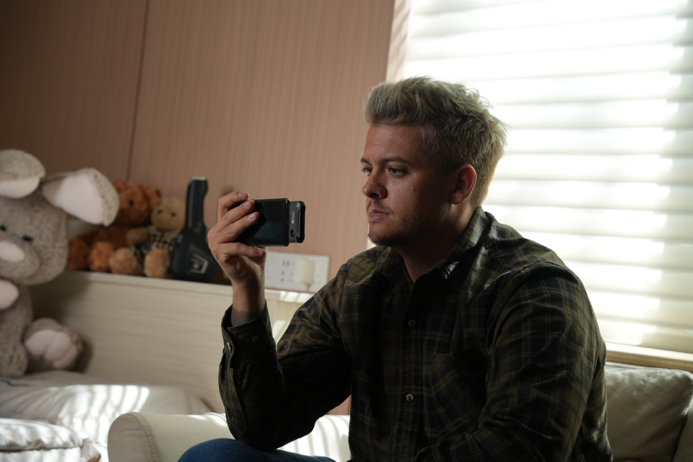 Person using a Thermal Master thermal camera for home inspection.