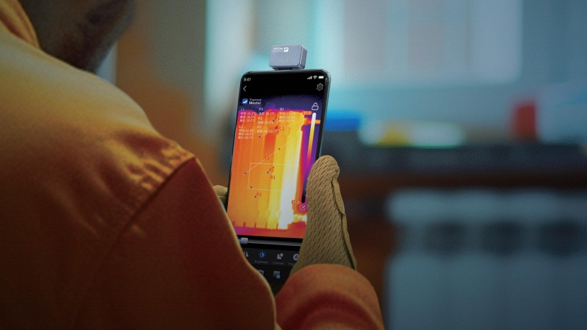 The man was holding a mobile phone thermal imager.
