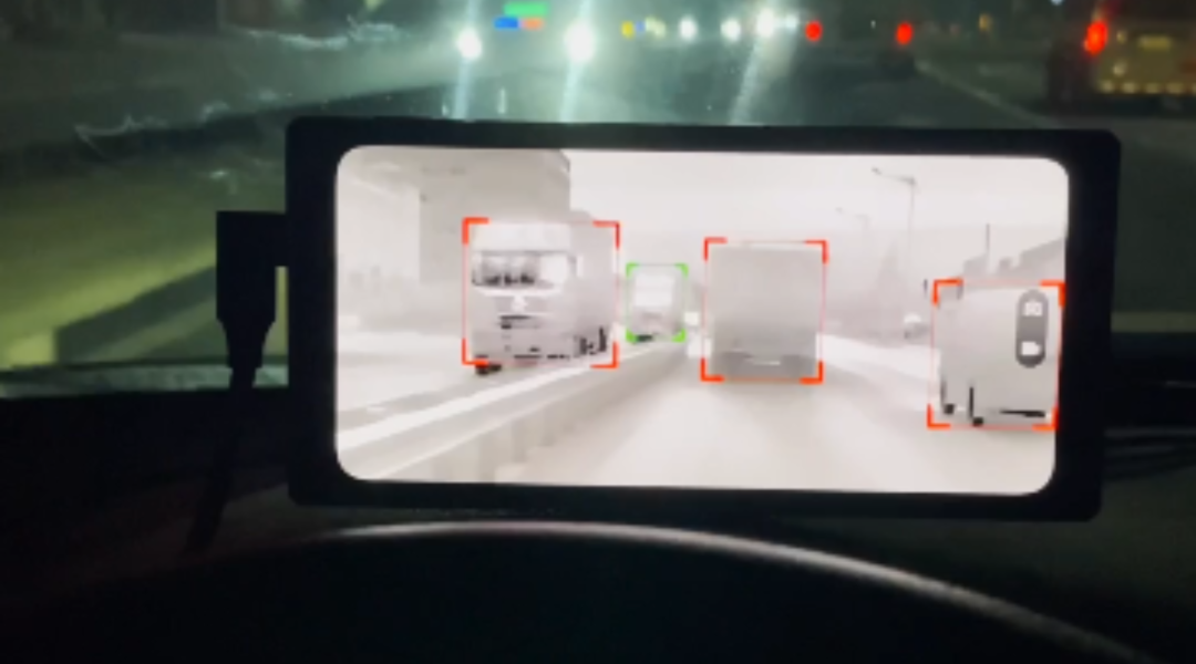 Night vision thermal cameras detect road conditions ahead and oncoming traffic.