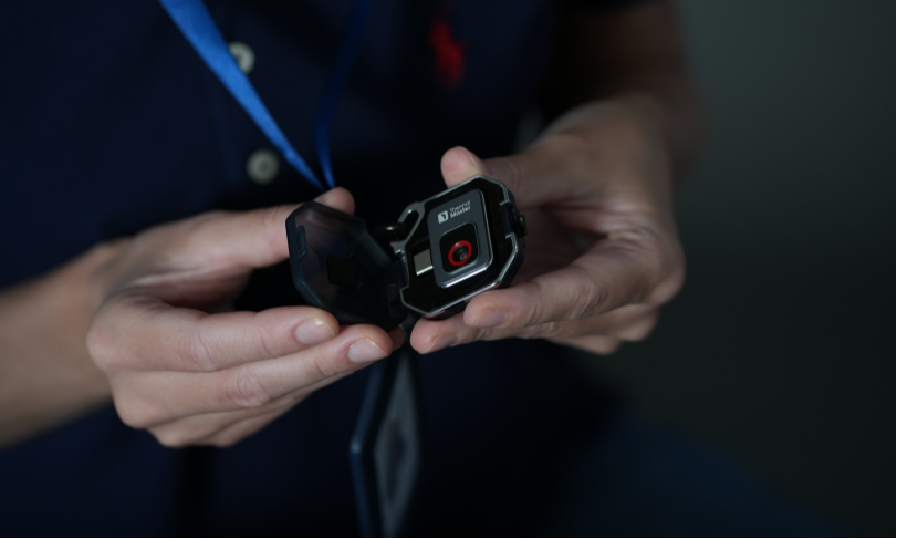 Holding a mobile phone thermal imager