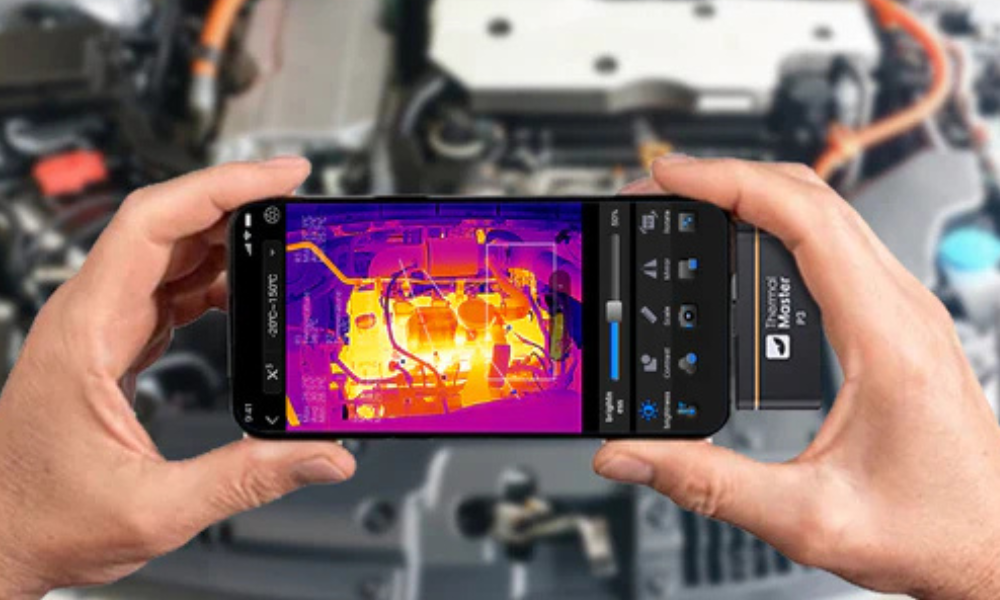 Inspect the front of the car with a mobile phone thermal imager.