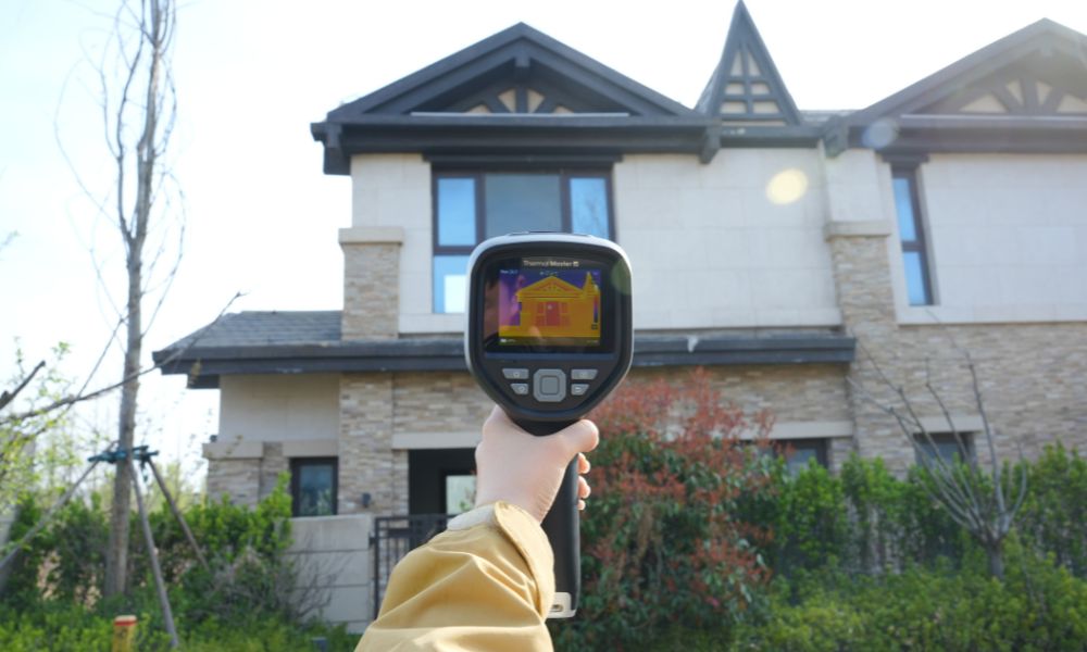 Inspect the house using a handheld thermal imager.