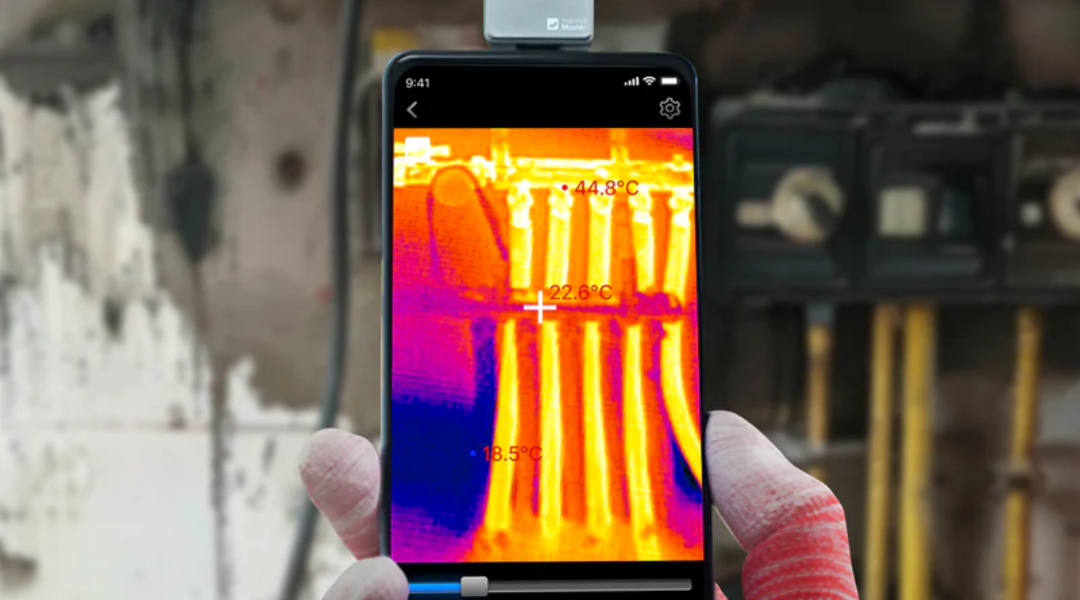 Using a smartphone thermal camera to inspect water pipes.